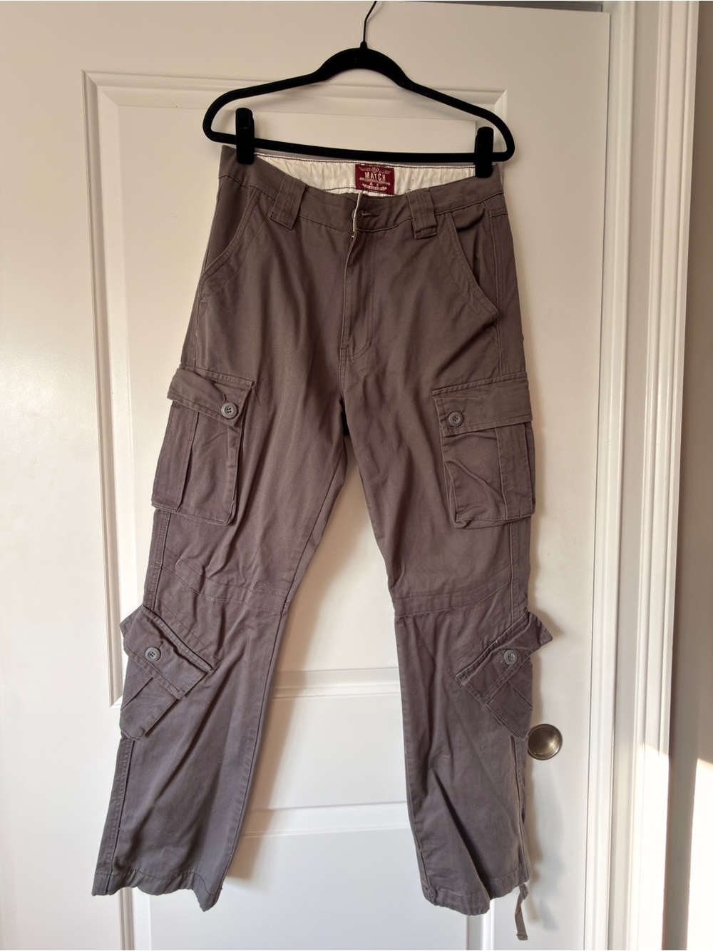 Match Taupe Cargo Pants with Utility Pockets
